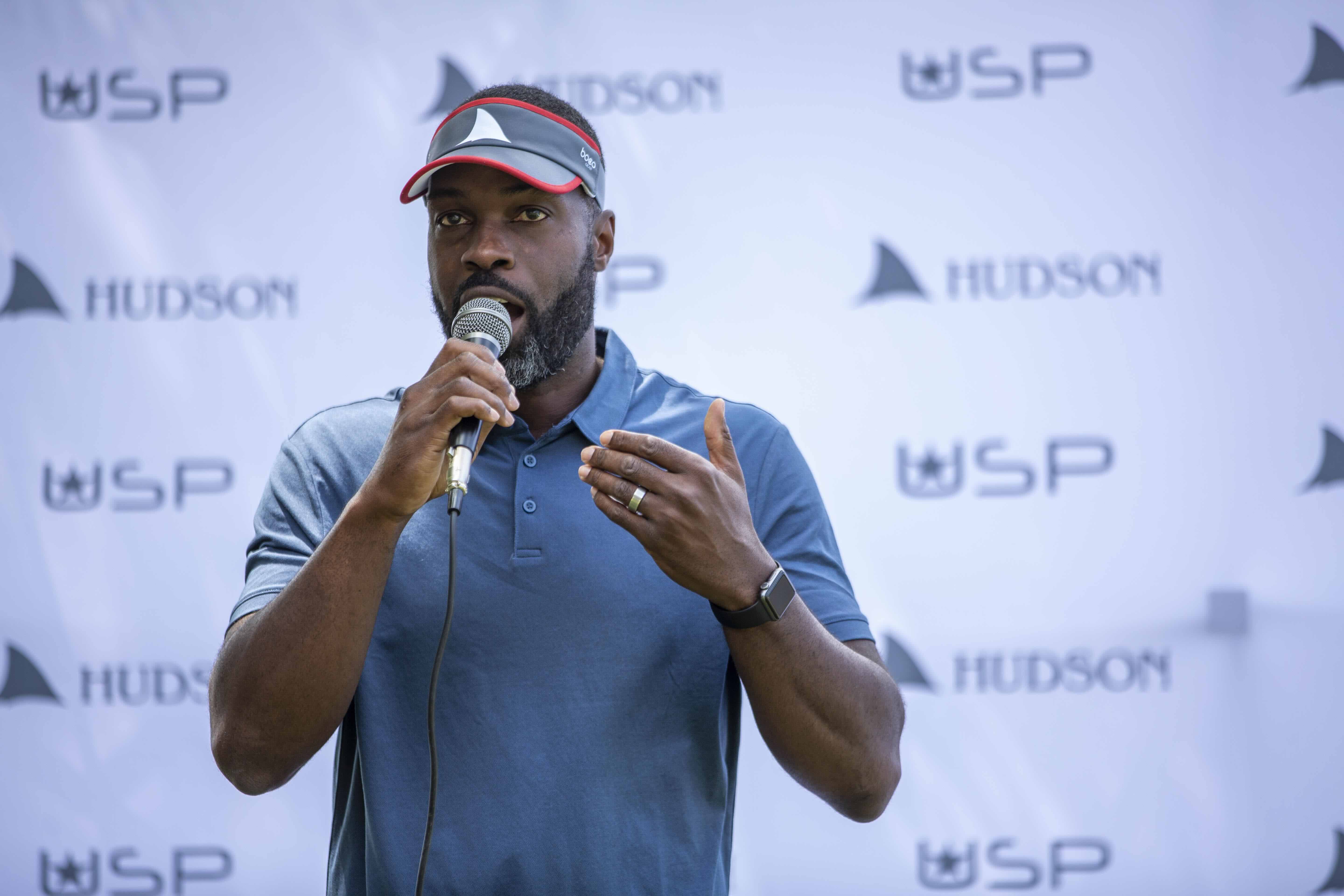 Aquil speaking at BLJ Community Rowing event