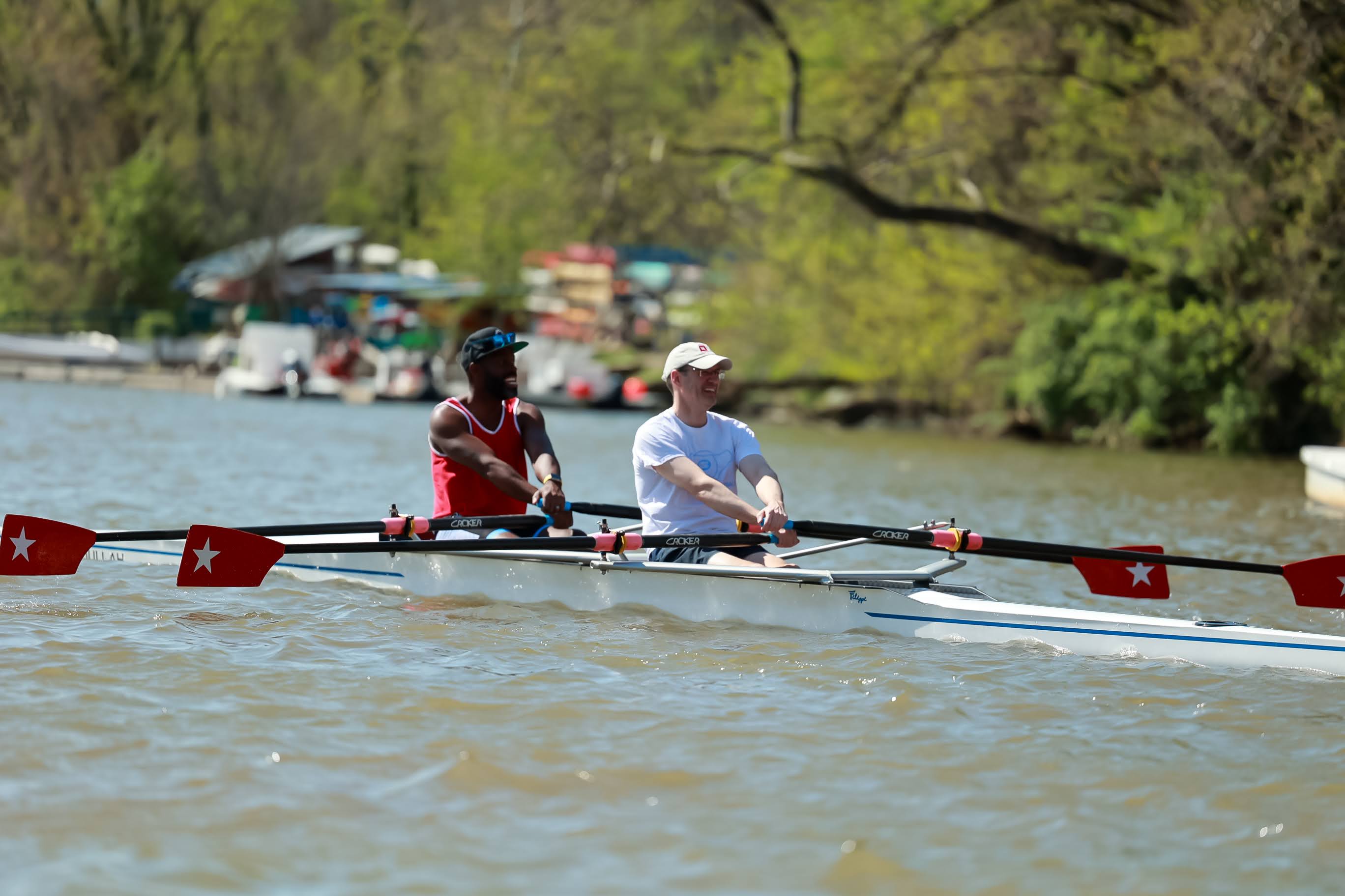 Aquil Abdullah in Bow and Henry Nuzum in stern, rowing on the Potomac River.